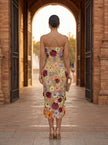 FJØRNA elegant floral strapless midi dress for women, showcasing a stylish and sophisticated dress with a flowing design.