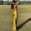 FJØRNA satin backless white maxi dress with a flowing silhouette and elegant design, perfect for formal occasions.