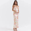 FJØRNA satin floral pencil maxi dress in white with a fitted silhouette and floral pattern, stylish and elegant for special occasions.