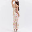 FJØRNA satin floral pencil maxi dress in white, featuring a fitted silhouette and elegant floral pattern, shown on a model.