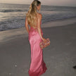 FJØRNA satin halter neck maxi dress for women, elegant evening and formal wear with flowing fabric and stylish design.