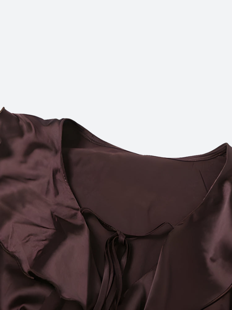 FJØRNA satin ruffled mini dress with layered ruffle details and a fitted silhouette, perfect for elegant evening wear.