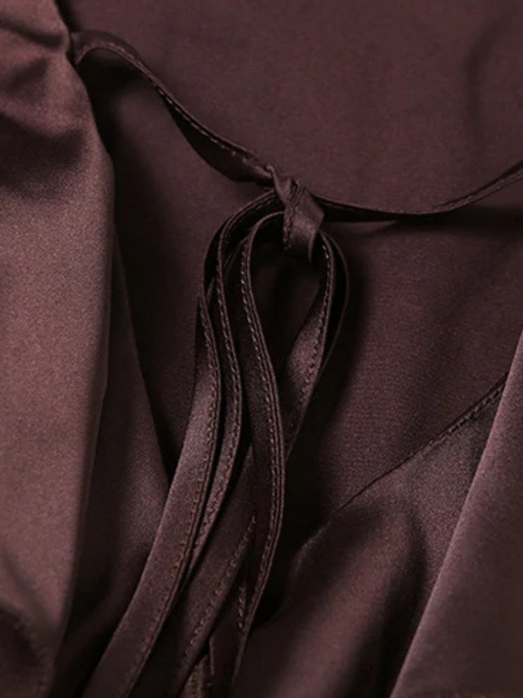 FJØRNA satin ruffled mini dress with delicate ruffle details and smooth satin fabric, perfect for stylish evening wear.