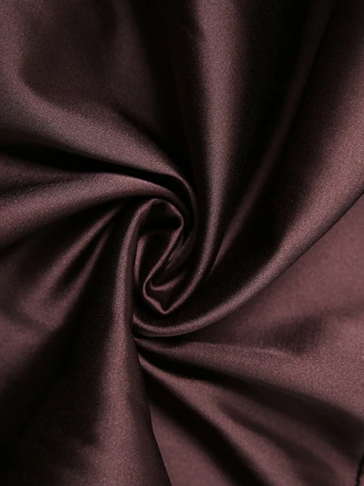 FJØRNA satin ruffled mini dress shown from the front with delicate ruffle details and a fitted silhouette.