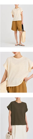 FJØRNA oversized tee with rolled cuffs, soft fabric, and relaxed fit, displayed flat on a neutral background.