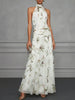 FJØRNA Jasmine floral halter wedding guest dress with elegant design and vibrant floral pattern, perfect for special occasions.