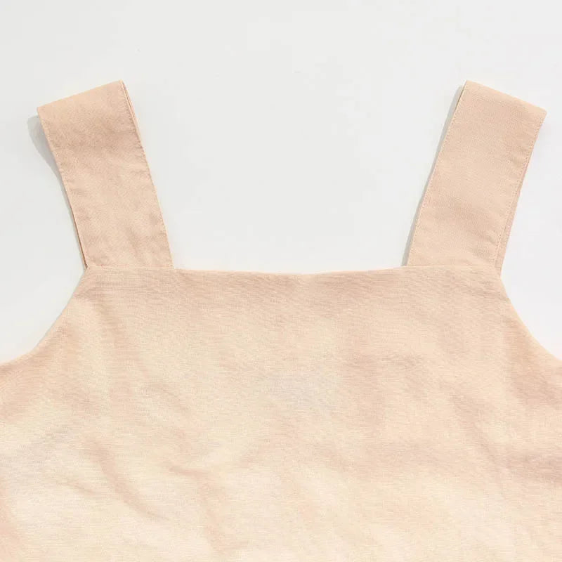 FJØRNA square neck linen cropped tank top displayed on a hanger, showcasing its lightweight, breathable fabric and stylish design.