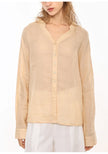 FJØRNA women's linen V-neck shirt, lightweight and breathable top, shown in a natural fit with soft fabric and subtle V-neck design.