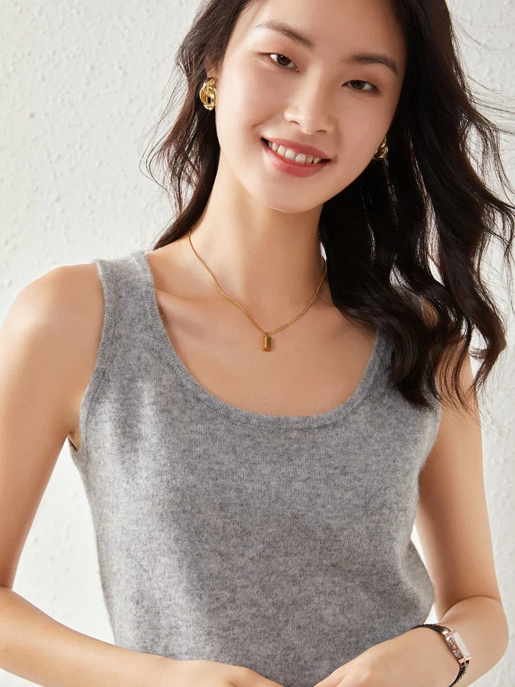 Soft beige FJØRNA women's cashmere top featuring a relaxed fit and long sleeves, perfect for cozy, stylish everyday wear.