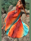FJØRNA elegant maxi dress for women featuring cut-out details, flowing fabric, and a sophisticated eveningwear design.