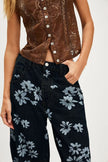 Women’s wide-leg denim jeans by FJØRNA, showcasing the relaxed fit and classic blue denim fabric.