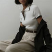 Women’s white cotton polo top by FJØRNA, short-sleeve casual shirt with a classic collar and button placket.