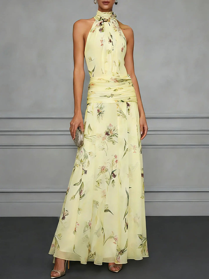 Jasmine floral halter wedding guest dress by FJØRNA with a flowy silhouette and floral pattern, perfect for summer events.