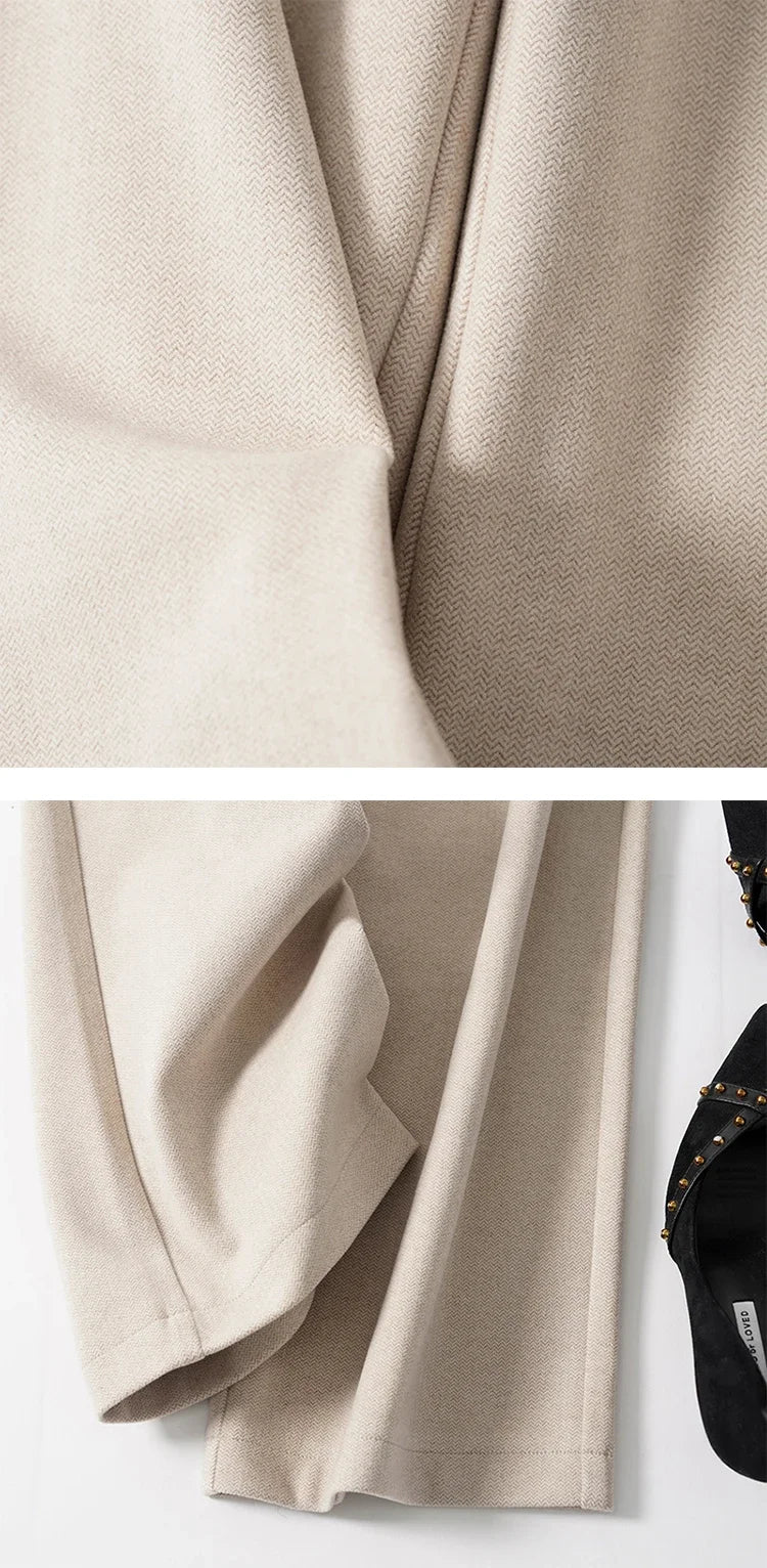 Women's wool wide-leg high-waist trousers from FJØRNA, featuring a tailored fit and classic design in neutral tones.