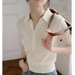 Ribbed knit polo blouse for women by FJØRNA, featuring a fitted design and classic collar, suitable for casual or office wear