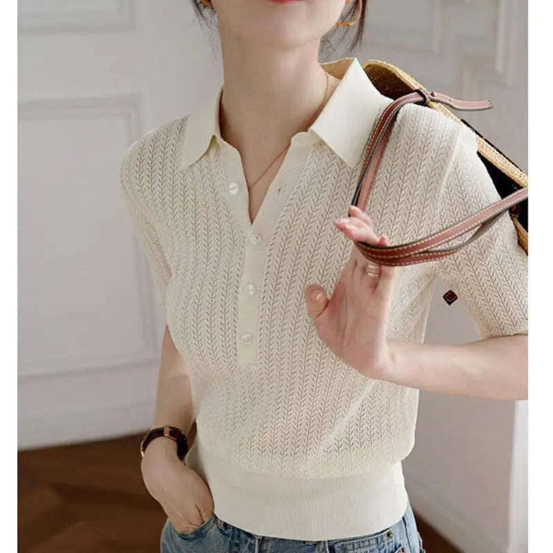 Ribbed knit polo blouse for women by FJØRNA, featuring a fitted design and classic collar, suitable for casual or office wear