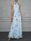 Jasmine floral halter wedding guest dress by FJØRNA featuring a flowy design and vibrant floral pattern