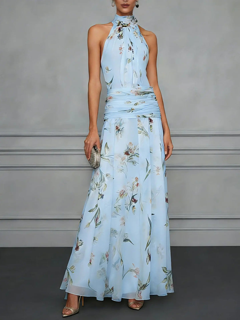 Jasmine floral halter wedding guest dress by FJØRNA featuring a flowy design and vibrant floral pattern