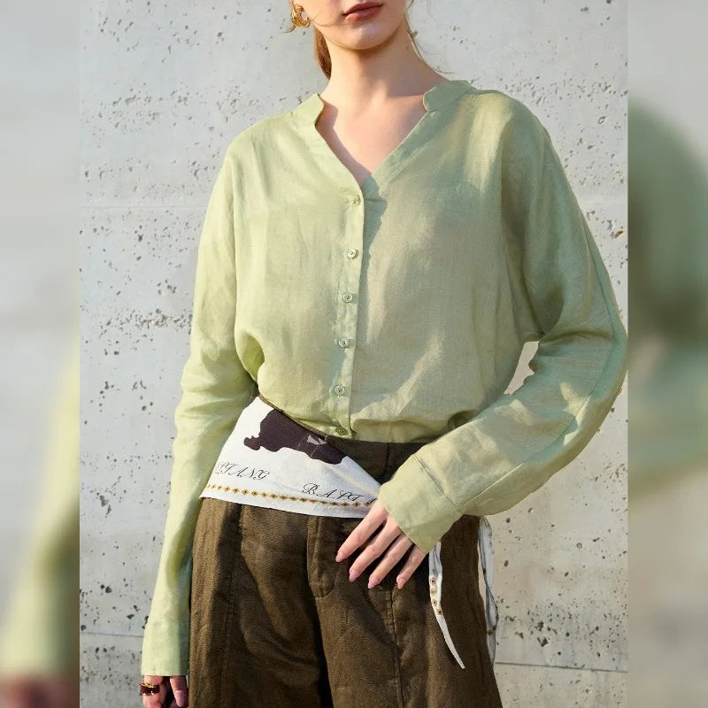 FJØRNA women's linen V-neck shirt, lightweight and breathable, shown in natural linen fabric with a relaxed fit.