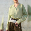 FJØRNA women's linen V-neck shirt, lightweight and breathable top with a relaxed fit, in natural linen fabric.