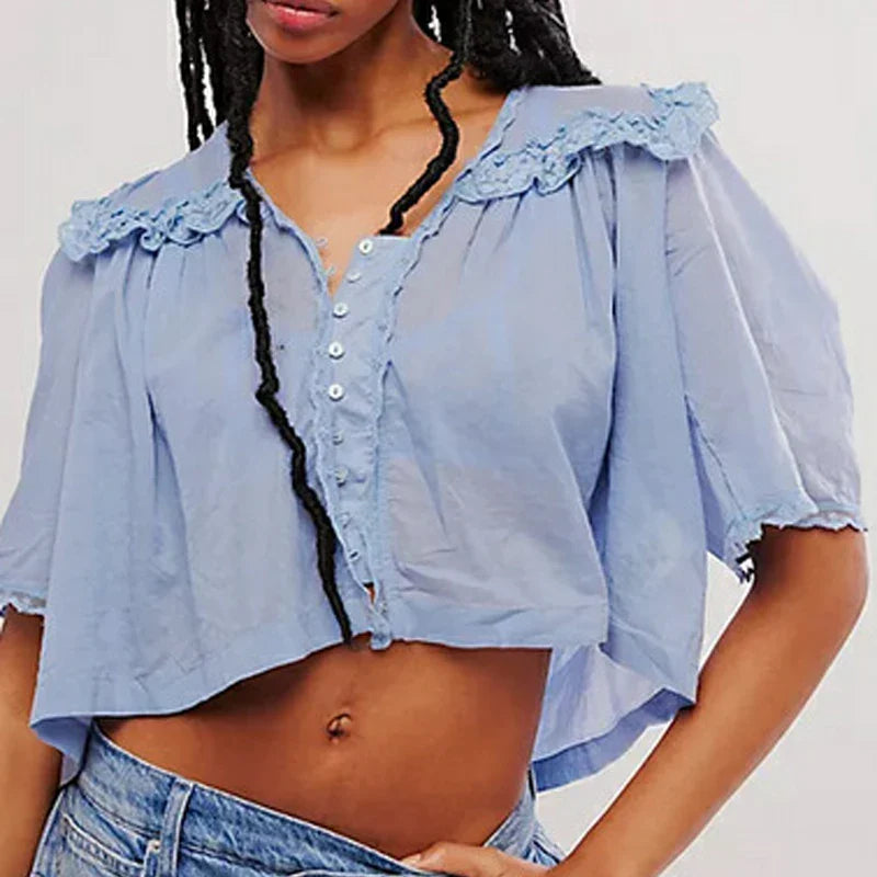 Women’s cotton blouse by FJØRNA featuring ruffle details, stylish and comfortable top for casual or dressy occasions.
