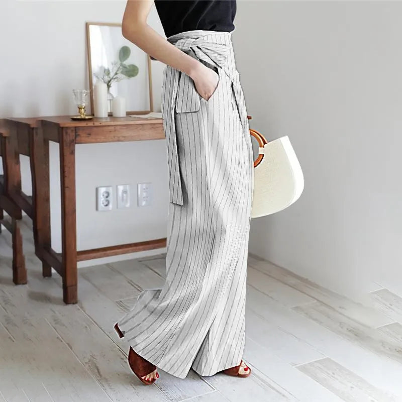 High-waist cotton wide-leg women's trousers by FJØRNA, showcasing relaxed fit and stylish design with natural stretch.