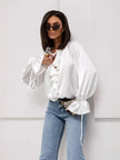 FJØRNA satin blouse for women with ruffle detail, shown in a stylish, elegant top with smooth fabric and feminine design.