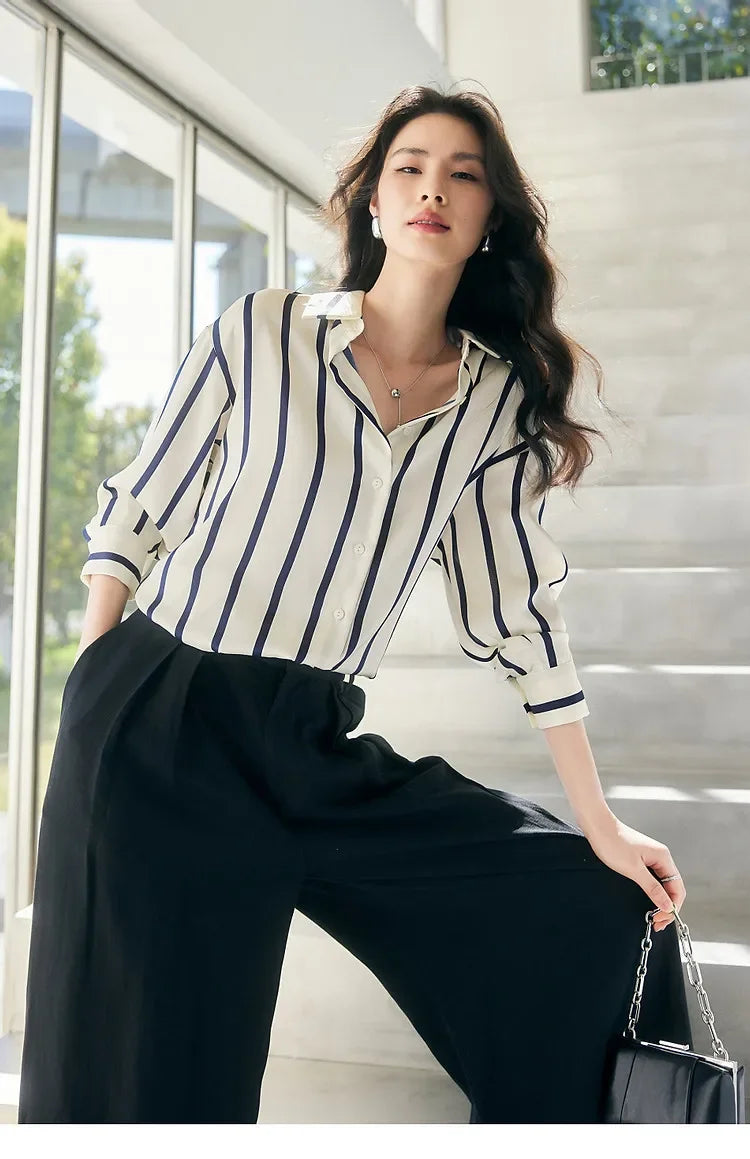 Lacceti Maren stripe satin blouse with long sleeves and button-up front, featuring elegant vertical stripe pattern.