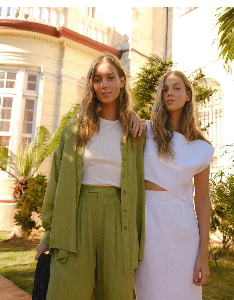 FJØRNA linen crop top for women, stylish and breathable, shown in soft fabric with a fitted design perfect for warm weather.