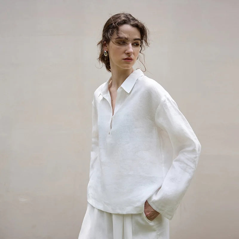 Women’s linen polo top with collar by FJØRNA, showcasing a lightweight, breathable blouse with a classic collar and relaxed fit.