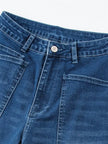 FJØRNA women's denim jeans with a barrel leg style, showcasing classic blue denim fabric and relaxed fit.