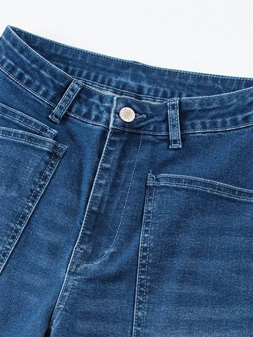 FJØRNA women's denim jeans with a barrel leg style, showcasing classic blue denim fabric and relaxed fit.