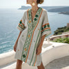 FJØRNA women's summer mini dress with floral pattern and V-neck, lightweight and casual for warm weather.
