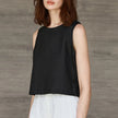 FJØRNA women's linen crop top featuring a lightweight, breathable design with a relaxed fit and stylish neckline.