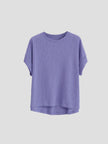 FJØRNA oversized tee with rolled cuffs, soft fabric, relaxed fit, and casual style, shown on a model.