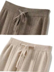 FJØRNA women's merino wool wide-leg high-waist trousers, beige, tailored fit, showcasing comfortable and stylish pants.