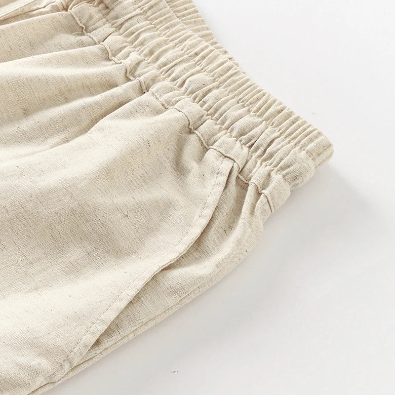 FJØRNA women's cotton linen wide-leg trousers with drawstring, pull-on style, relaxed fit, and casual chic design.