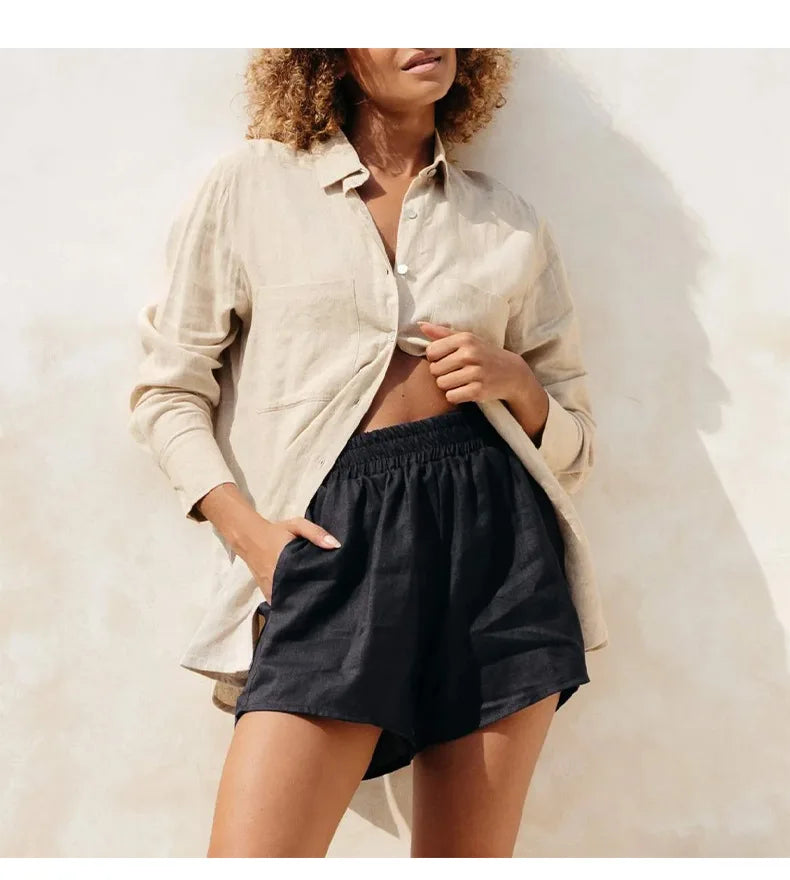 FJØRNA extra-large linen shirt with spacious pockets, showing a relaxed fit and natural fabric texture on a neutral background.