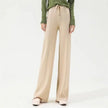 FJØRNA women's merino wool wide-leg high-waist trousers, stylish and comfortable pants with a relaxed fit and natural fiber texture.