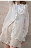 FJØRNA women's linen shirt, light and breathable tops for women, featuring a relaxed fit and natural fabric texture.