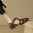 FJØRNA women's Italian leather sandals with adjustable straps, featuring stylish open-toe design and comfortable flat soles.