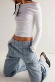FJØRNA women's wide-leg denim jeans showing high-waisted style, classic blue wash, and relaxed fit on a model.