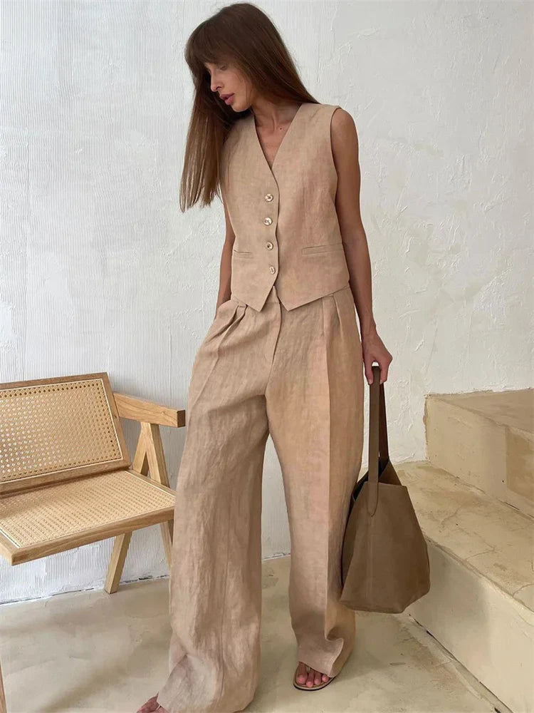 FJØRNA women's linen wide-leg trousers, stylish and comfortable pants for women, part of a co-ord set, shown in neutral fabric.