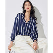 Lacceti Maren Stripe Satin Blouse featuring a stylish striped pattern and smooth satin fabric, displayed on a hanger.