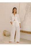 FJØRNA extra-large linen shirt with spacious pockets, shown in a relaxed fit with natural fabric texture and casual style.