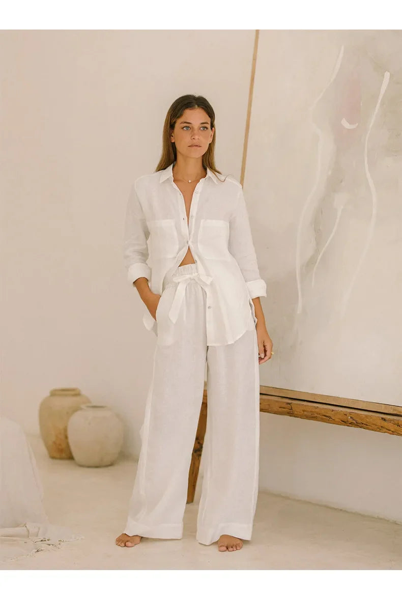FJØRNA extra-large linen shirt with spacious pockets, shown in a relaxed fit with natural fabric texture and casual style.
