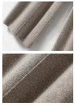 Women’s wide-leg Merino wool trousers by FJØRNA featuring high waist and comfortable fit, shown in a natural fabric texture.