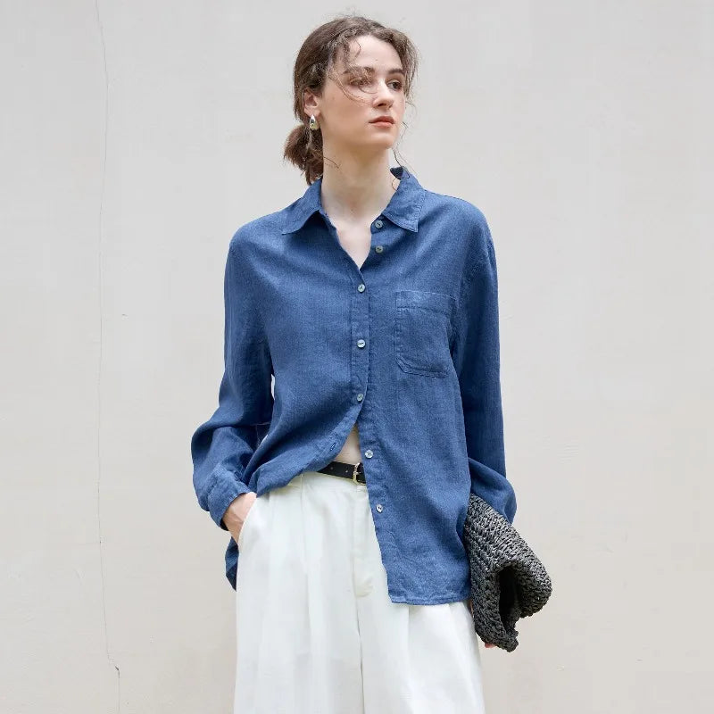 FJØRNA women's linen blend shirt, long sleeve tops with a relaxed fit, in soft neutral fabric, displayed on a hanger.