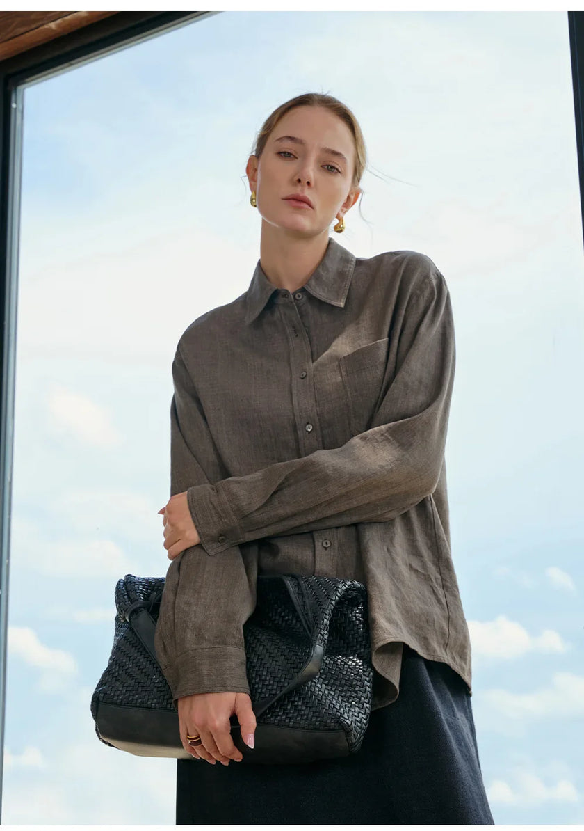 FJØRNA women's linen blend shirt featuring a relaxed fit, lightweight fabric, and classic collar, styled for casual wear.