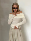 FJØRNA women's ribbed knit off-shoulder top, showing a close-up of the fitted, textured fabric and off-shoulder neckline.